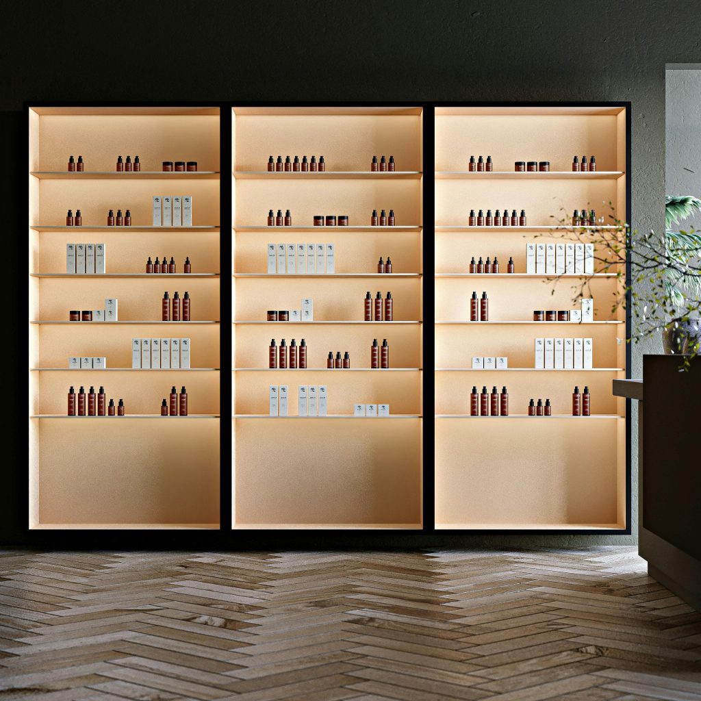 Elegant retail shelves showcasing beauty and wellness products under soft lighting for a minimalist interior design.